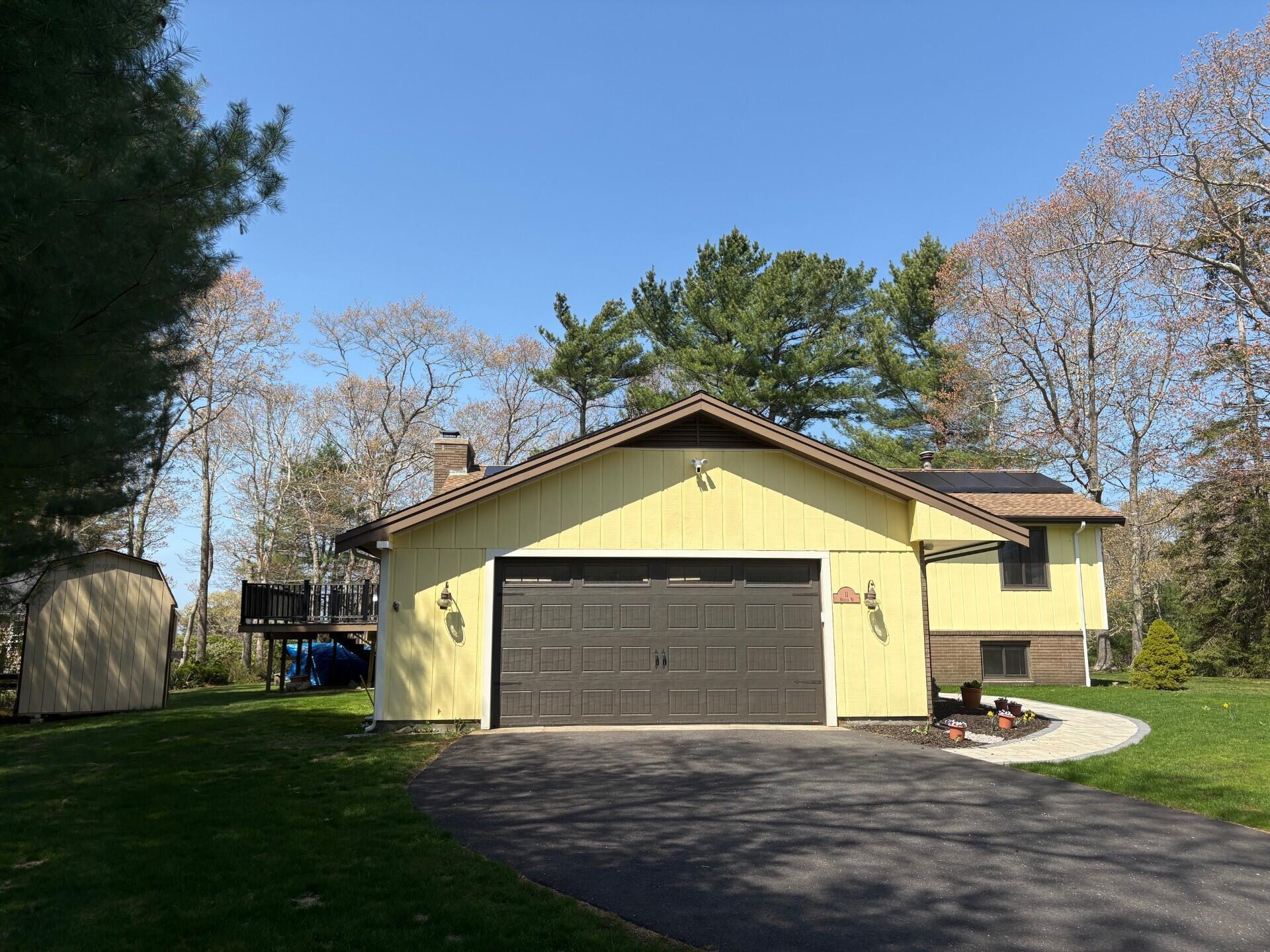 11 Michael Road Pocasset, MA 02559 - Photo 3 of 35 a front view of a house with garden