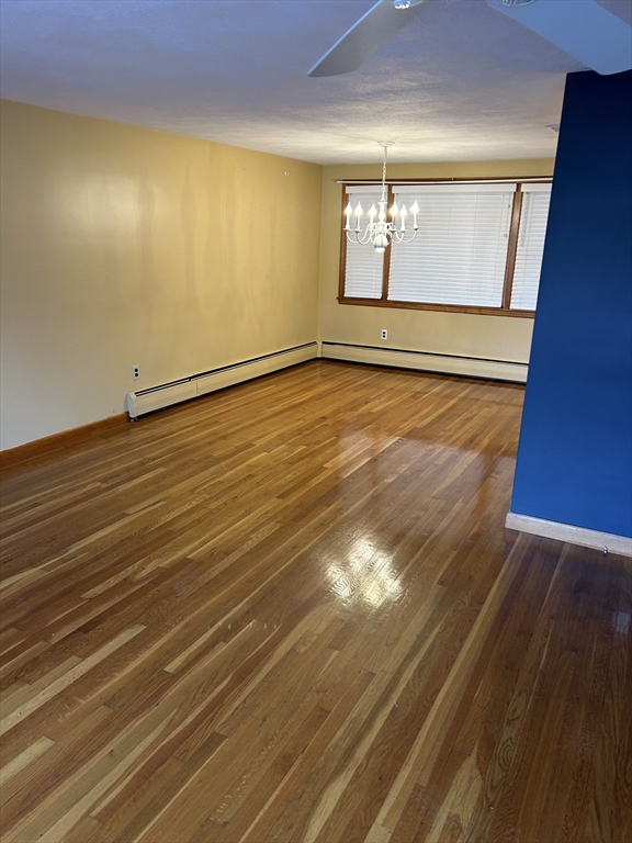21 Athens Drive Saugus, MA 01906 - Photo 11 of 18 a view of empty room with wooden floor