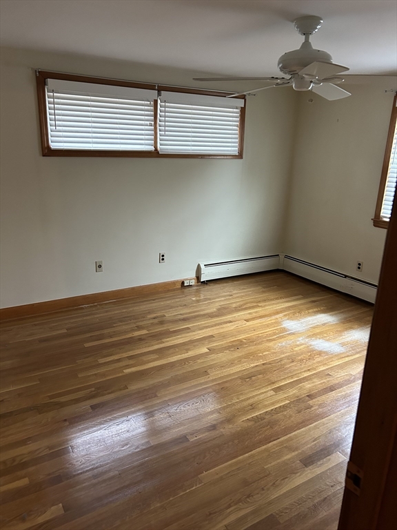 21 Athens Drive Saugus, MA 01906 - Photo 16 of 18 a view of a room with wooden floor and fan
