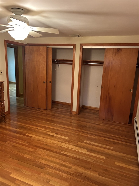 21 Athens Drive Saugus, MA 01906 - Photo 18 of 18 a view of empty room with wooden floor and fan