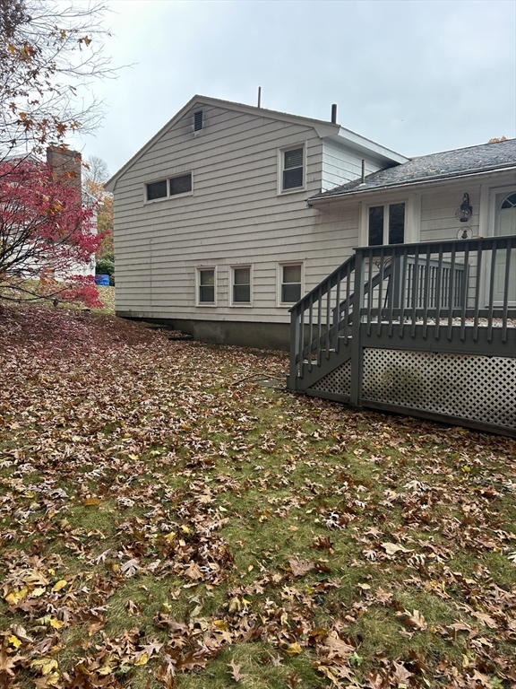 21 Athens Drive Saugus, MA 01906 - Photo 2 of 18 a backyard of a house with lots of green space