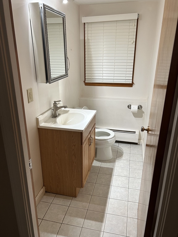 21 Athens Drive Saugus, MA 01906 - Photo 7 of 18 a bathroom with a sink a toilet and mirror