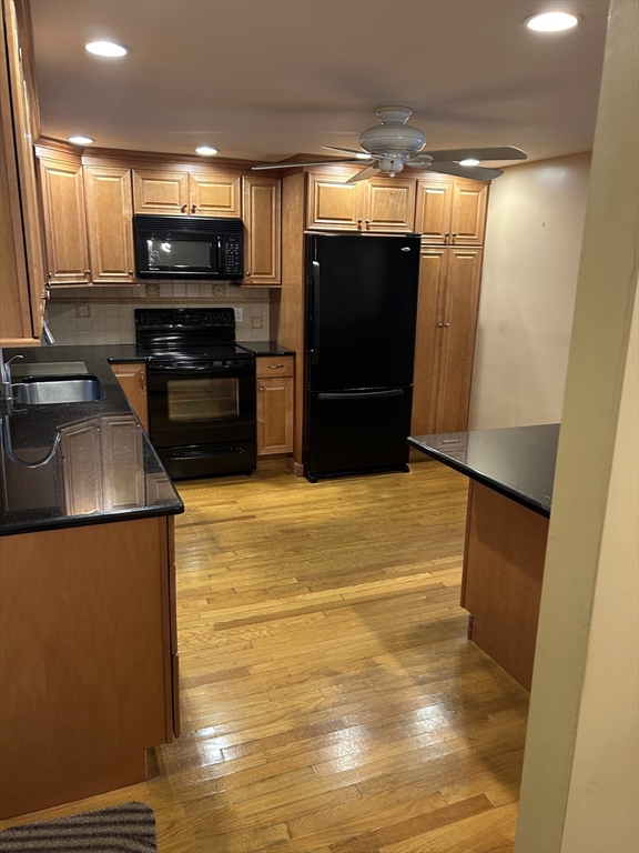 21 Athens Drive Saugus, MA 01906 - Photo 10 of 18 a kitchen with stainless steel appliances a refrigerator and a stove