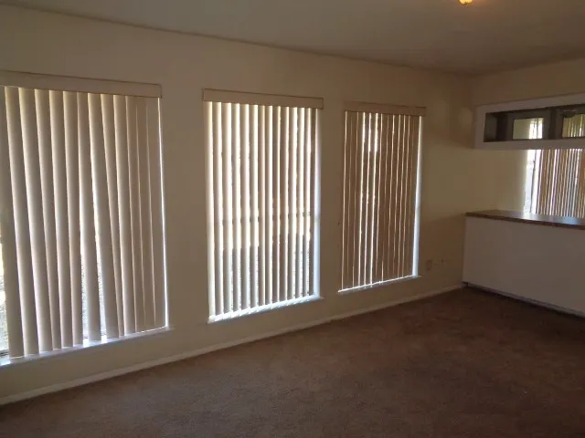 a kitchen with a sink a stove and cabinets