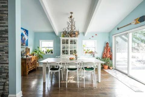 a view of a dining room with furniture window and wooden floor