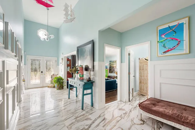 a bathroom with a tub sink and mirror