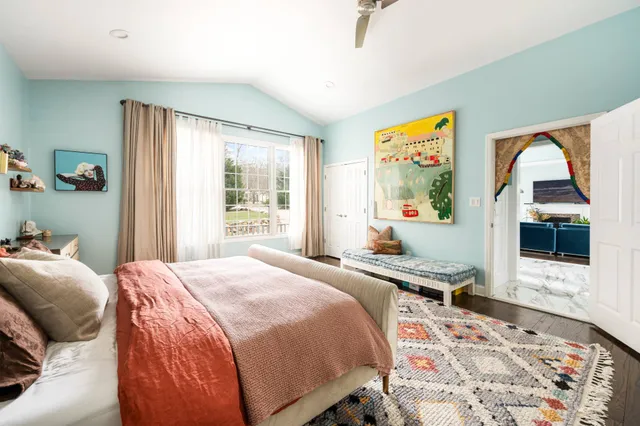 a bedroom with bed and a couch