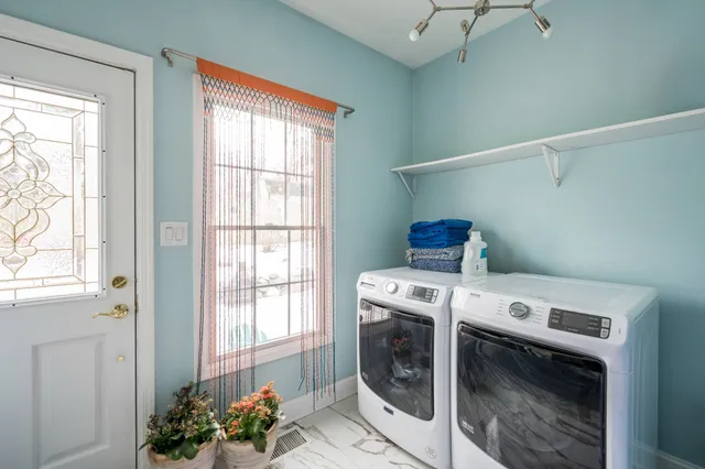 a backyard of a house with outdoor seating