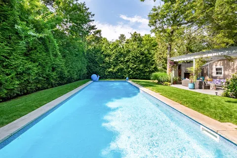 a view of a backyard with a small pool