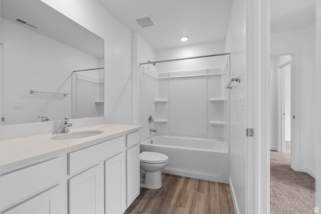 2133 Wolverine Way, Unit 2440 Washington, UT 84780 - Photo 22 of 39 Bathroom featuring a single vanity with a white countertop and integrated sink, chrome faucet, and white cabinetry