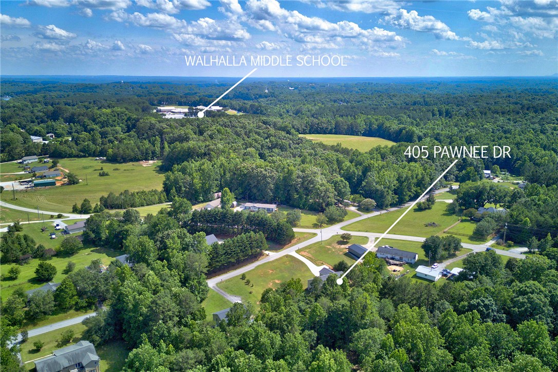 405 Pawnee Drive Walhalla, SC 29691 - Photo 32 of 36 An aerial perspective showcases a property nestled amidst a vibrant, green rural landscape.