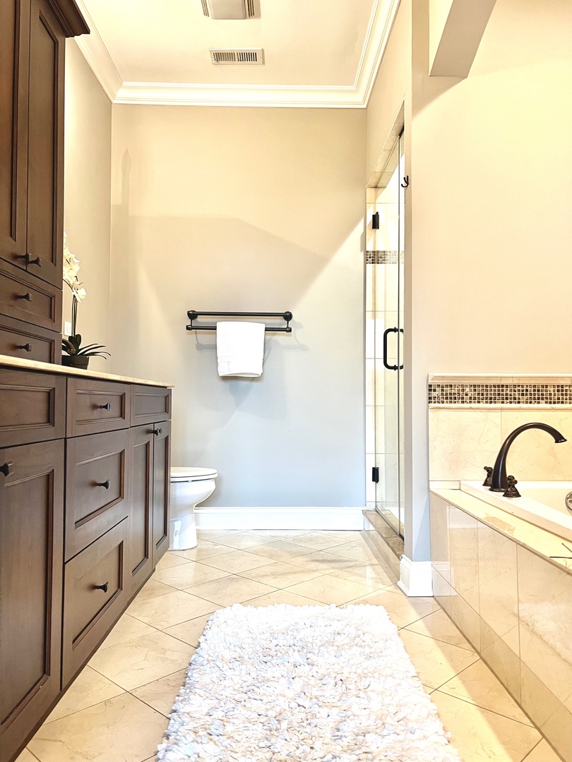 1503 West Thomas Street, Unit 2E Chicago, IL 60642 - Photo 11 of 12 a bathroom with a tub sink and mirror