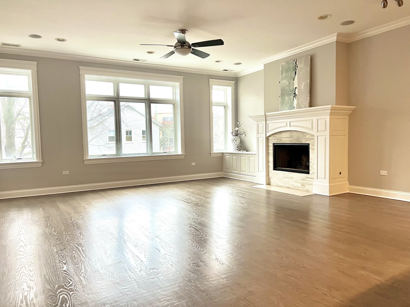 1503 West Thomas Street, Unit 2E Chicago, IL 60642 - Photo 2 of 12 a view of an empty room with wooden floor and a window
