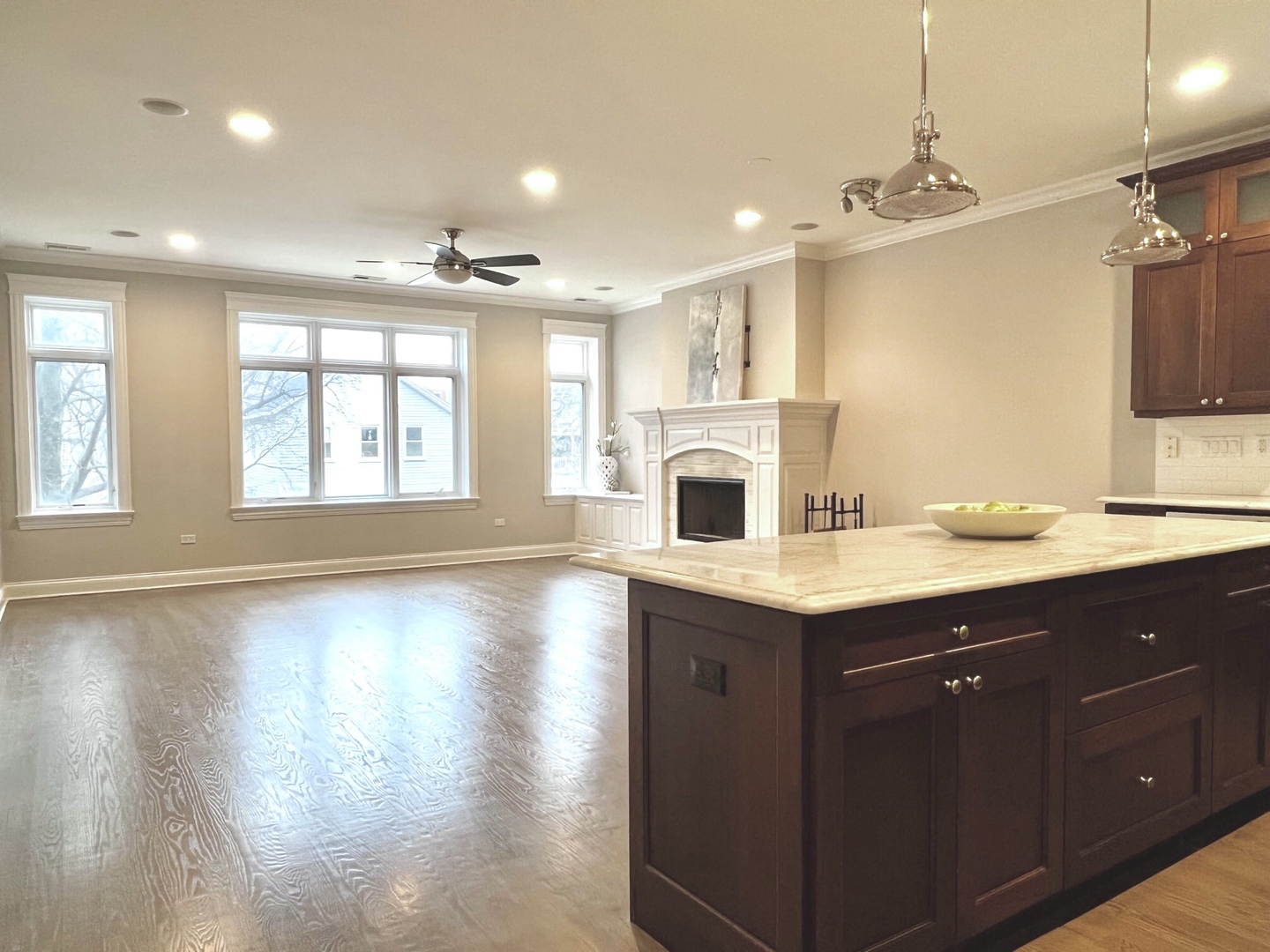 1503 West Thomas Street, Unit 2E Chicago, IL 60642 - Photo 6 of 12 a view of a kitchen with a sink dishwasher and fireplace