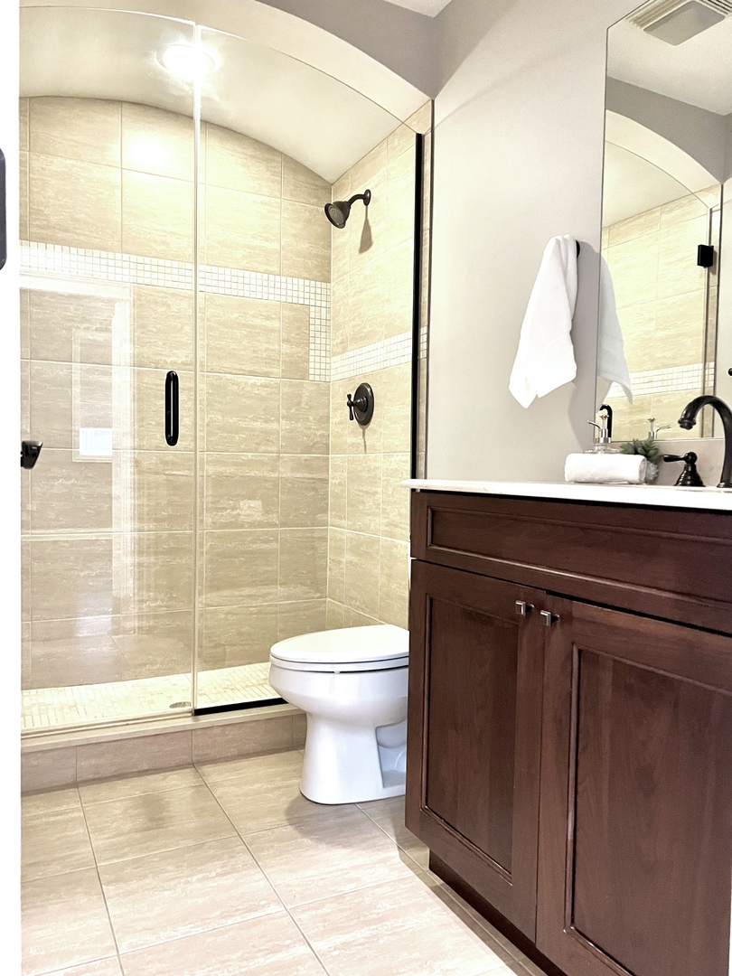 1503 West Thomas Street, Unit 2E Chicago, IL 60642 - Photo 8 of 12 a bathroom with a sink mirror toilet and shower