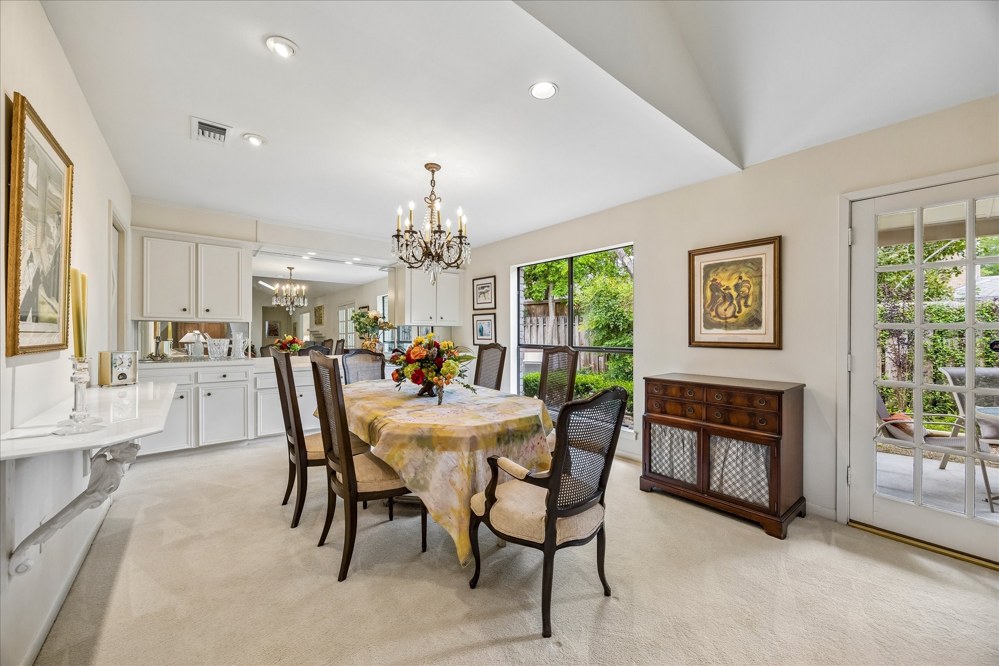 307 Oarman Court Houston, TX 77079 - Photo 11 of 38 a view of a dining room with furniture a chandelier and wooden floor