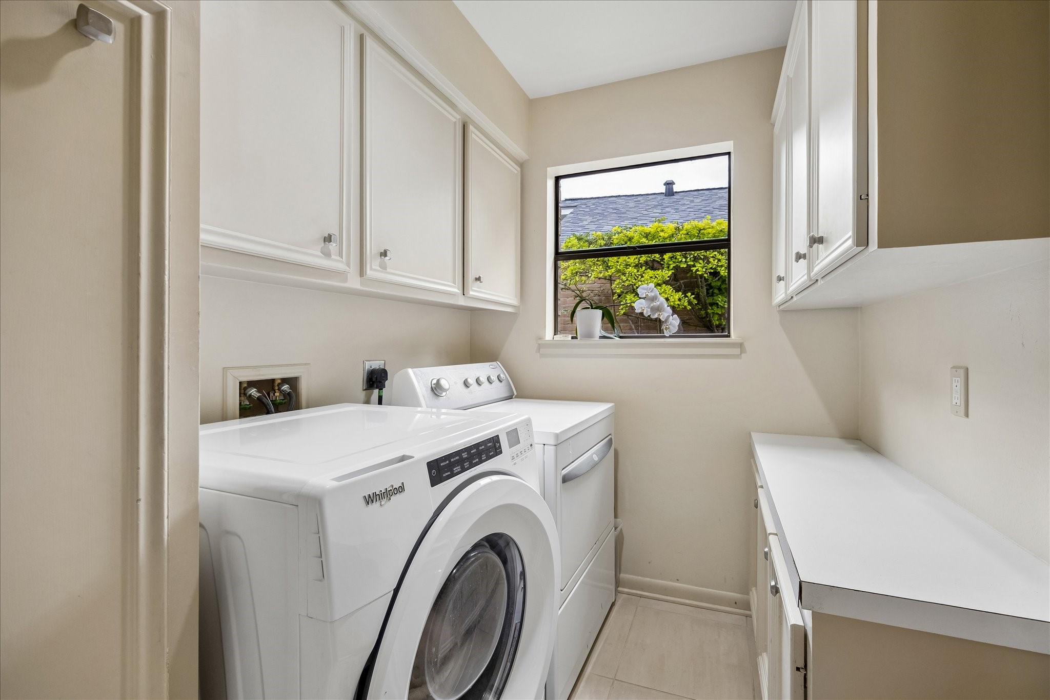 307 Oarman Court Houston, TX 77079 - Photo 18 of 38 a utility room with dryer and washer