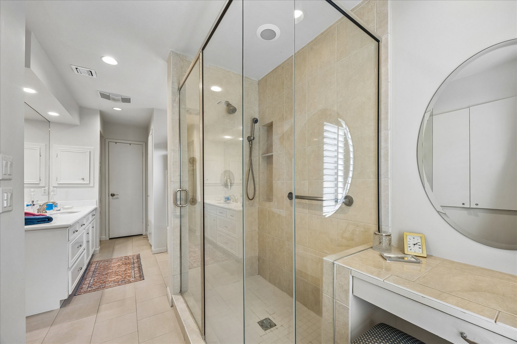 307 Oarman Court Houston, TX 77079 - Photo 23 of 38 a bathroom with a double vanity sink mirror and shower