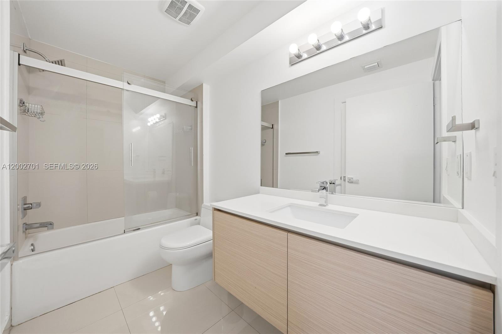 600 Northeast 27th Street, Unit 1002 Miami, FL 33137 - Photo 13 of 30 a bathroom with a sink a toilet and shower