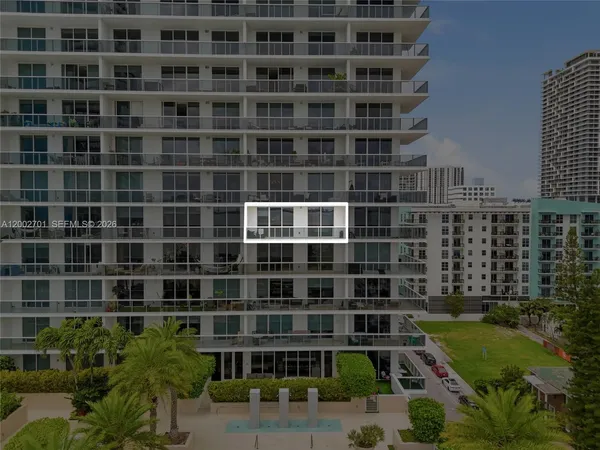 a view of a building with a yard