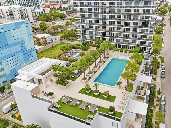 a view of swimming pool with outdoor seating