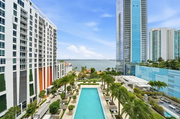 a view of a swimming pool with chairs