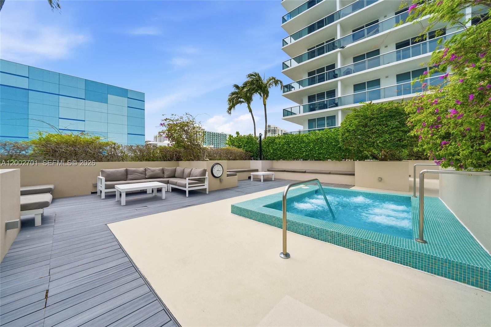 600 Northeast 27th Street, Unit 1002 Miami, FL 33137 - Photo 24 of 30 a view of a swimming pool with chairs