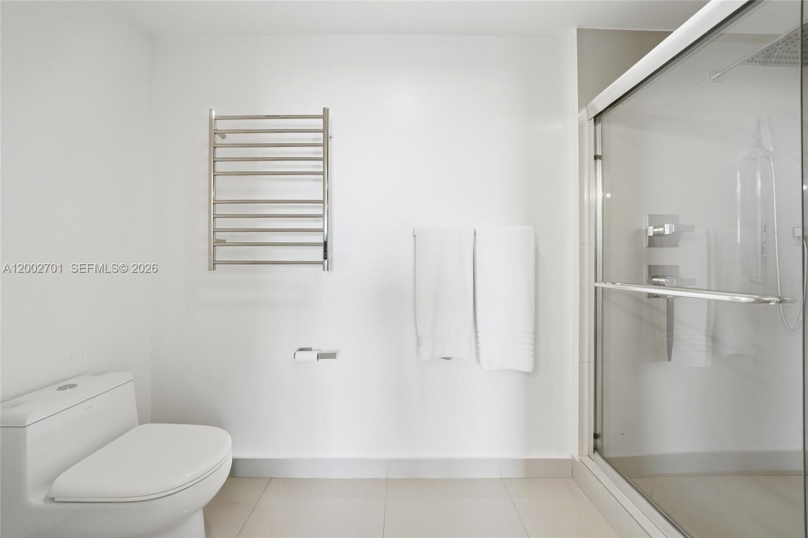 600 Northeast 27th Street, Unit 1002 Miami, FL 33137 - Photo 7 of 30 a bathroom with a toilet and a shower