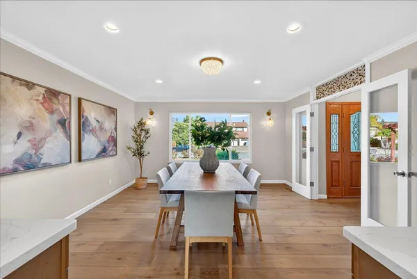 a kitchen with stainless steel appliances kitchen island granite countertop a sink and cabinets