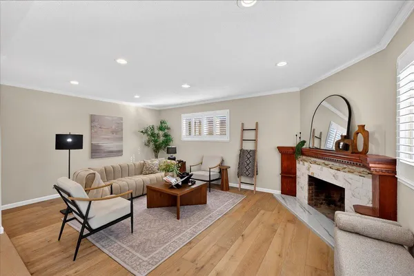 a kitchen with stainless steel appliances granite countertop a sink a stove and a wooden cabinets