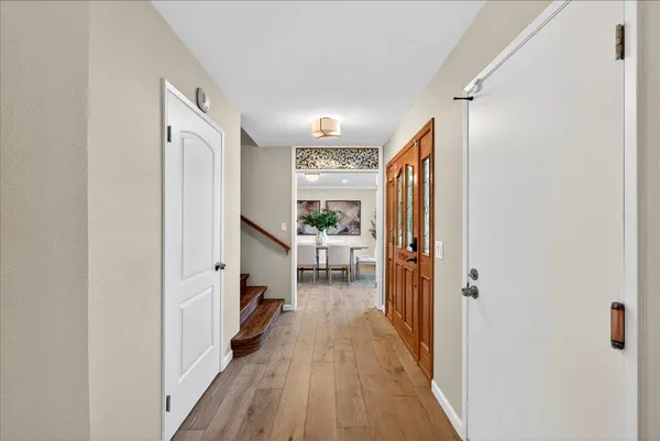 a view of a dining room with furniture and window