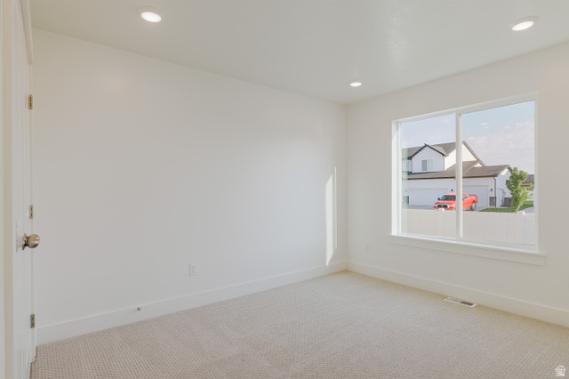 433 North 600 West Smithfield, UT 84335 - Photo 27 of 40 Neutral white walls complement recessed lighting and light-colored carpeting