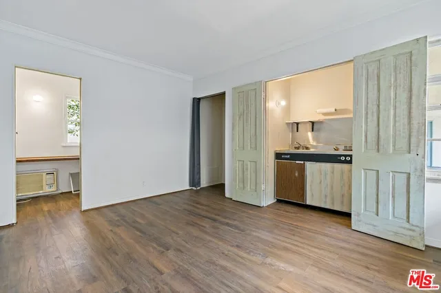 a view of kitchen with granite countertop cabinets and wooden floor