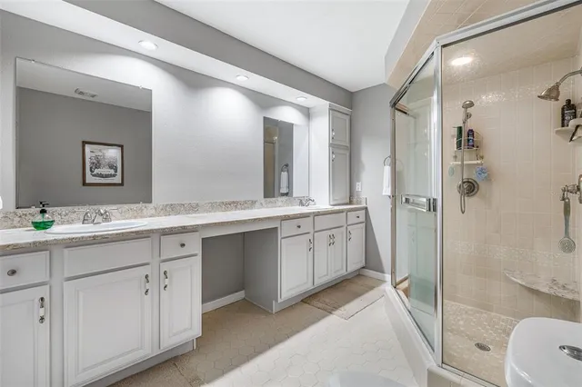 an aerial view of a house with backyard