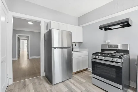 a kitchen with appliances and cabinets