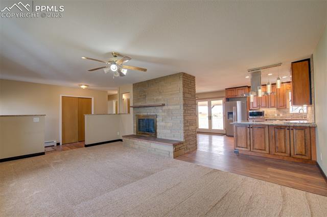 7845 Wilson Road Fountain, CO 80817 - Photo 13 of 30 Living room open to the kitchen
