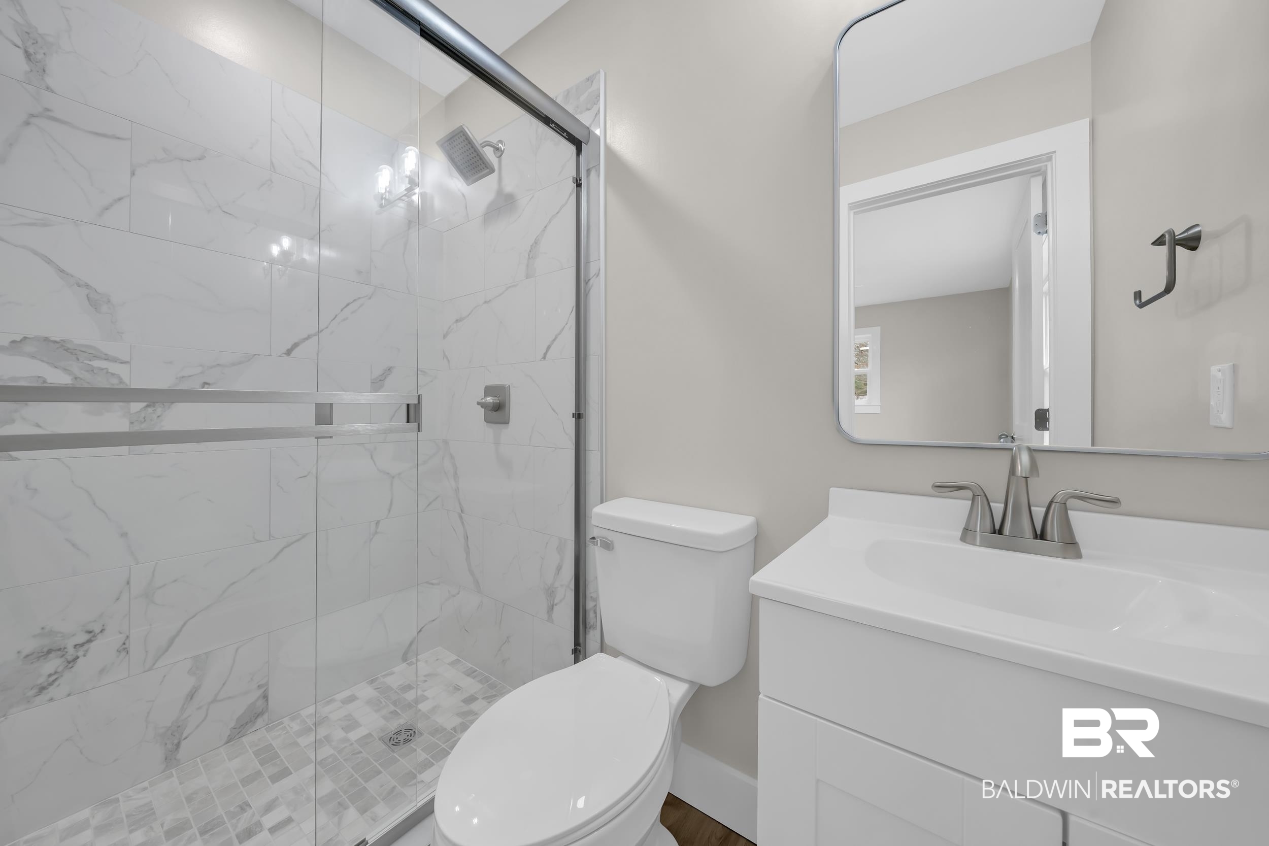 11381 Normandy Drive East Semmes, AL 36575 - Photo 17 of 23 Bathroom featuring vanity and a marble finish shower