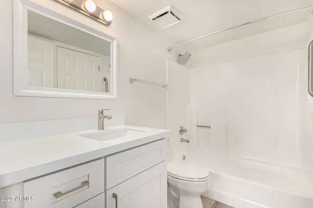 a bathroom with a sink a toilet and a bathtub