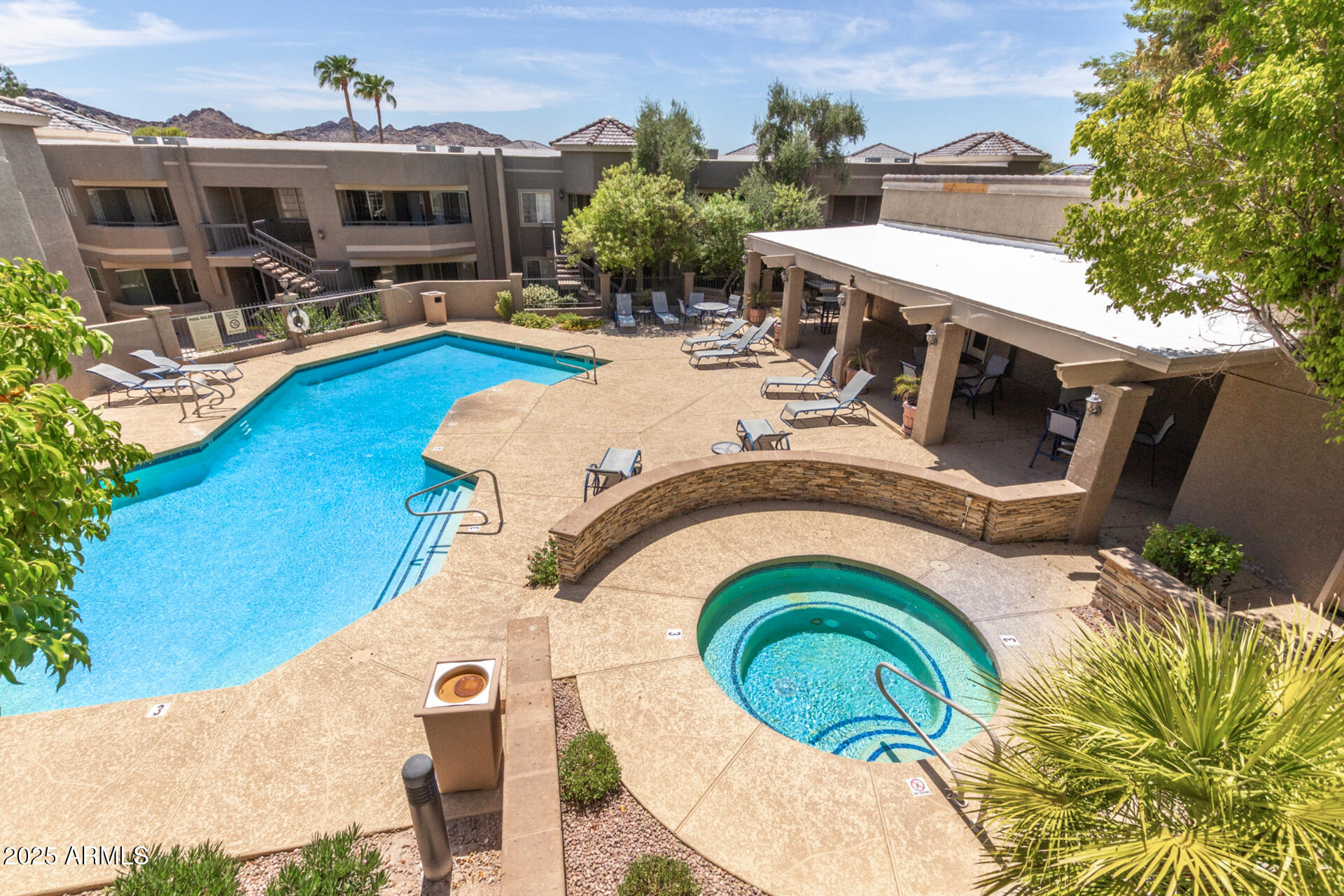 1720 East Thunderbird Road, Unit 2044 Phoenix, AZ 85022 - Photo 19 of 22 a view of a swimming pool with a patio and a yard