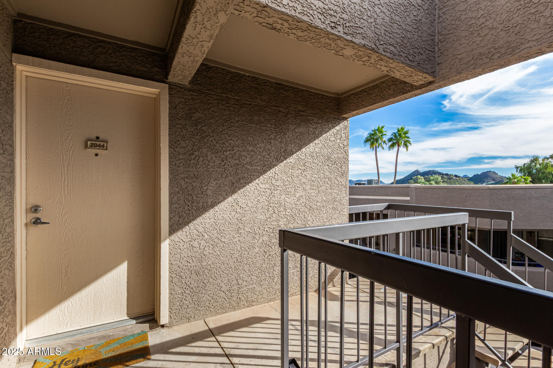 1720 East Thunderbird Road, Unit 2044 Phoenix, AZ 85022 - Photo 2 of 22 a balcony with wooden floor