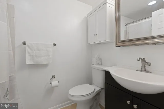 a view of a livingroom with workspace and a window