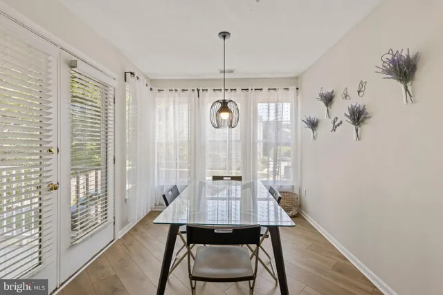 a view of a room with furniture and wooden floor