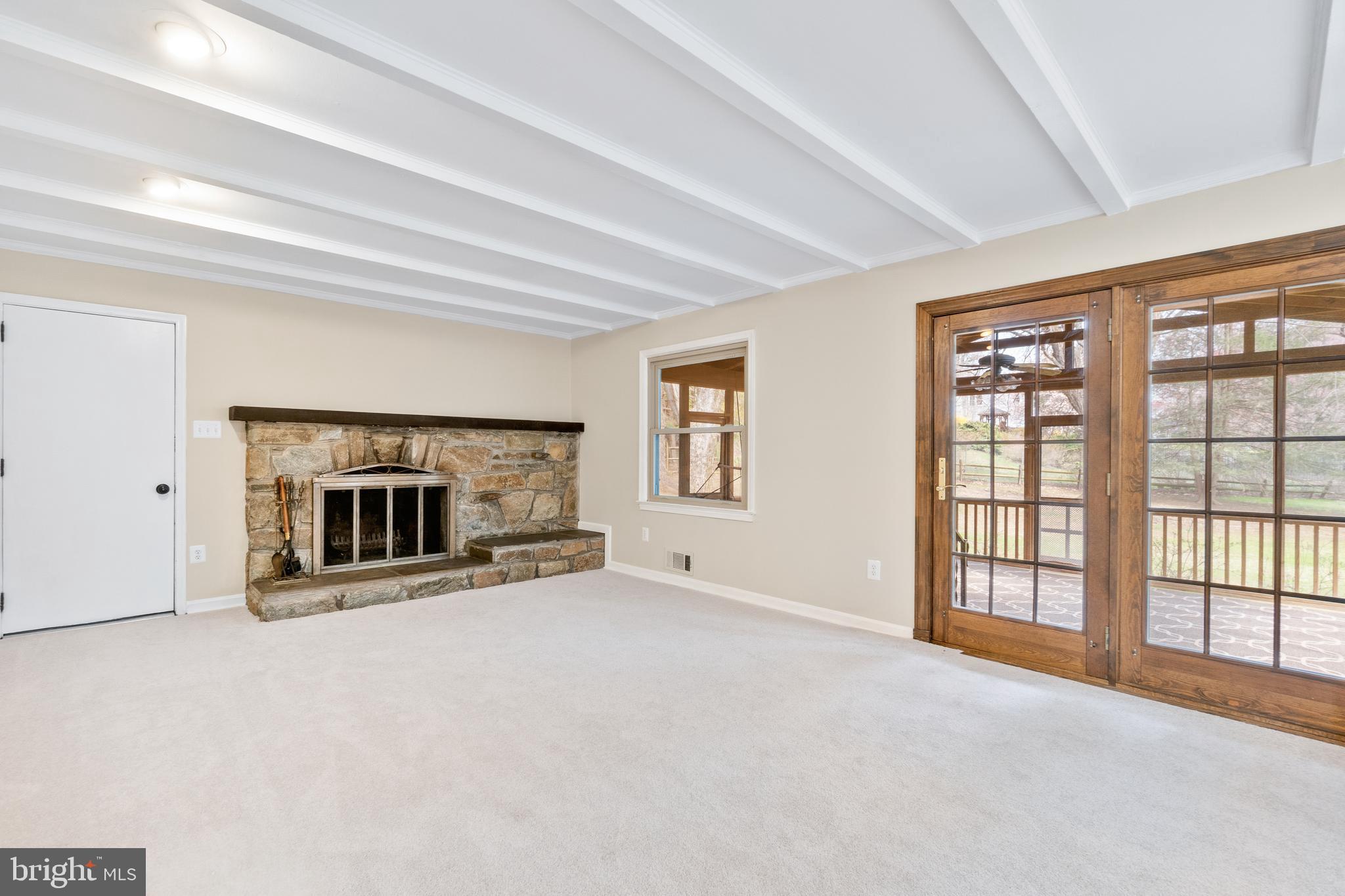 13605 Stoner Drive Silver Spring, MD 20904 - Photo 12 of 47 a view of an empty room with a fireplace and a window