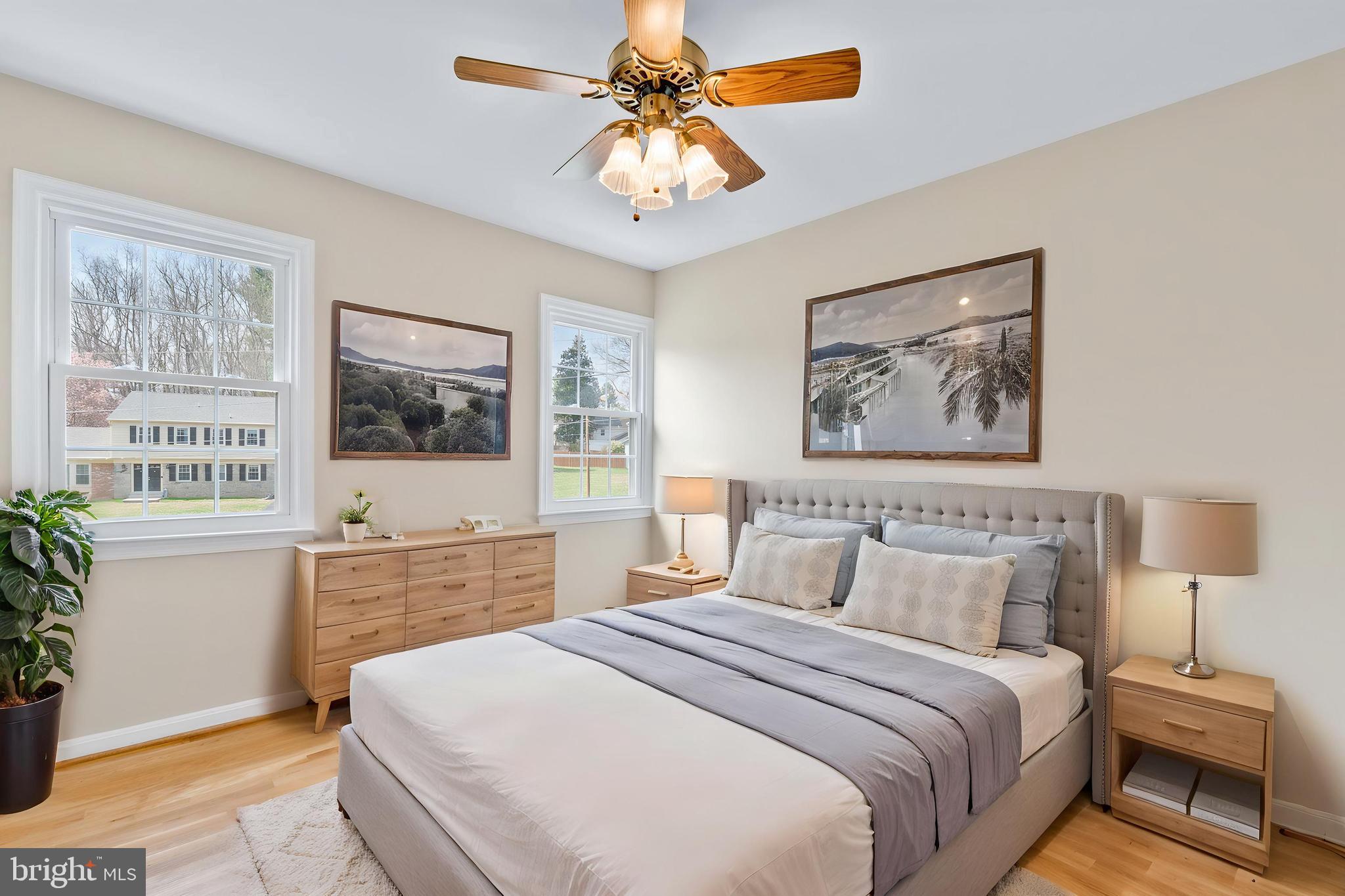 13605 Stoner Drive Silver Spring, MD 20904 - Photo 25 of 47 a bedroom with a large bed a chandelier and window