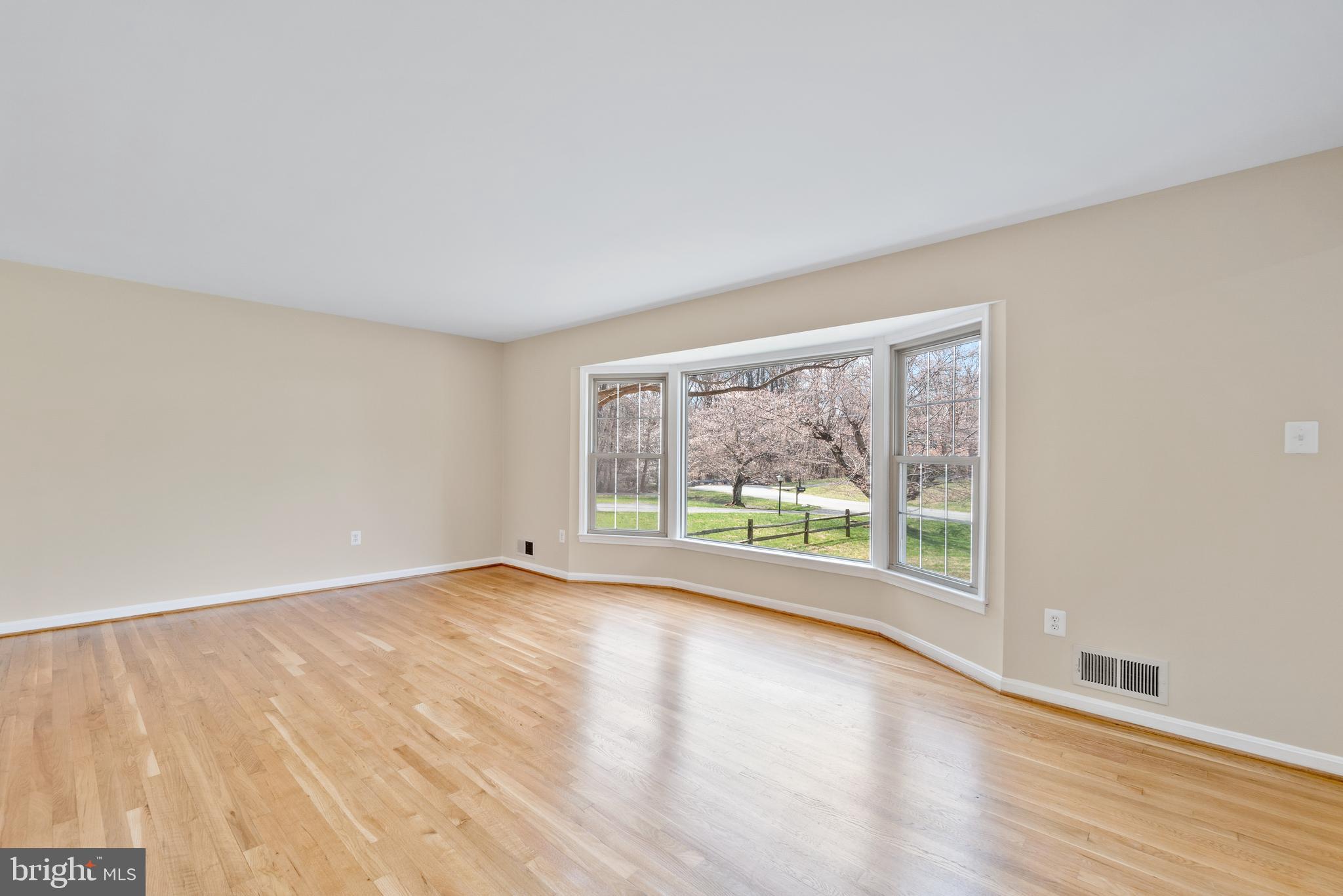 13605 Stoner Drive Silver Spring, MD 20904 - Photo 3 of 47 a view of an empty room with wooden floor and a window
