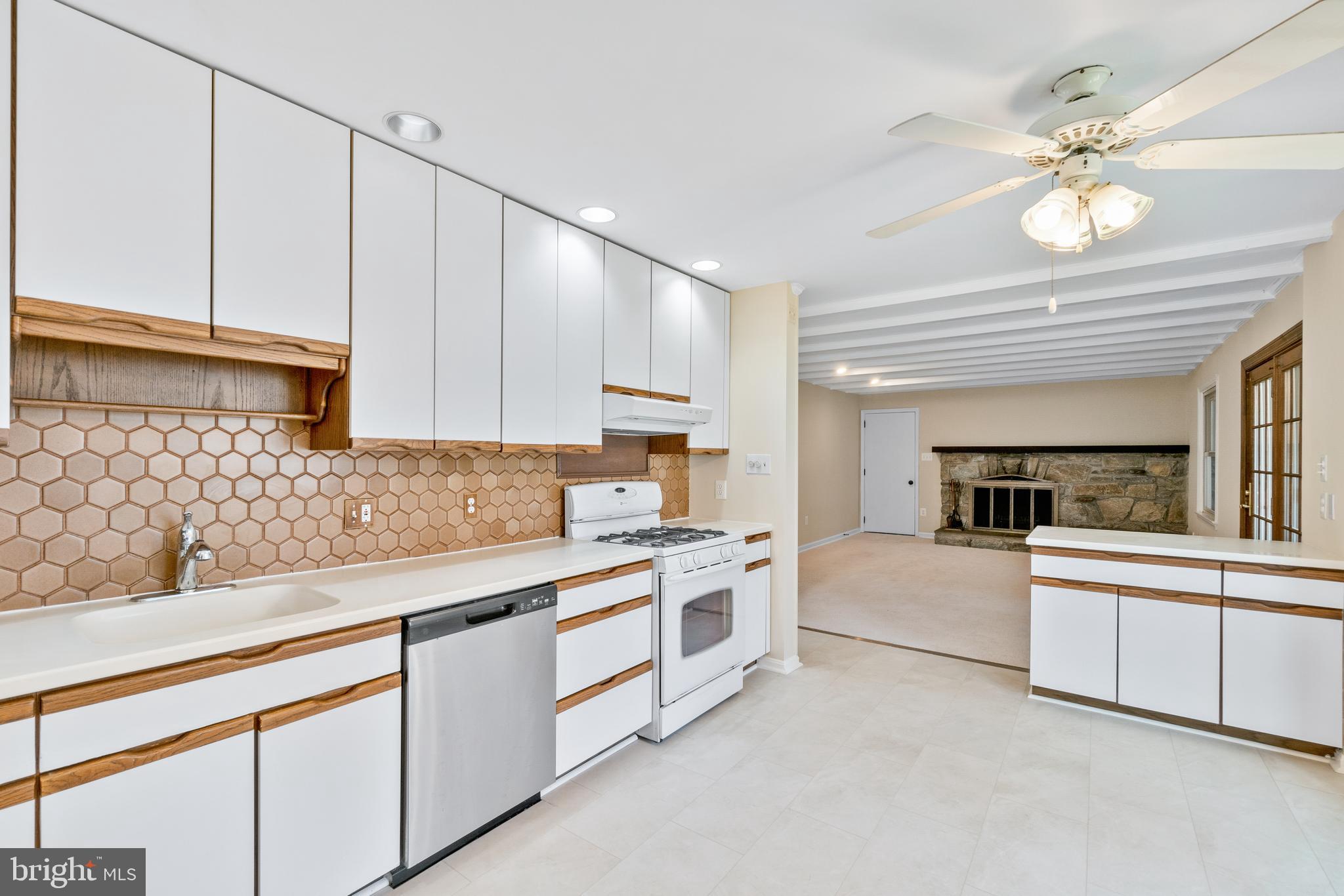 13605 Stoner Drive Silver Spring, MD 20904 - Photo 10 of 47 a kitchen with white cabinets and white appliances