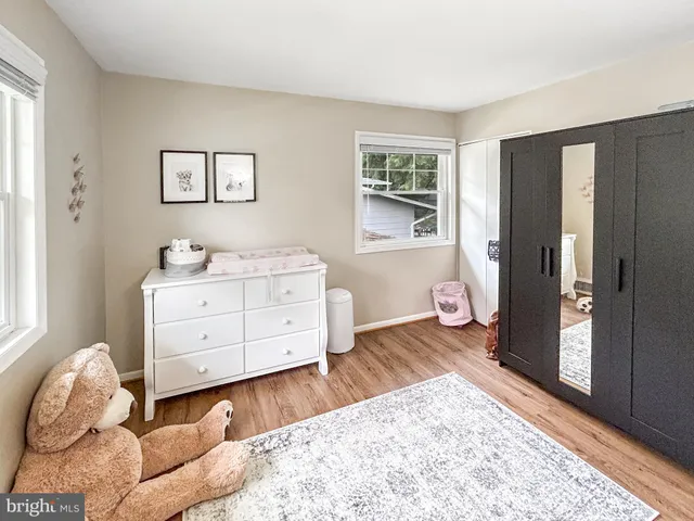 a bed room with a bed and a window