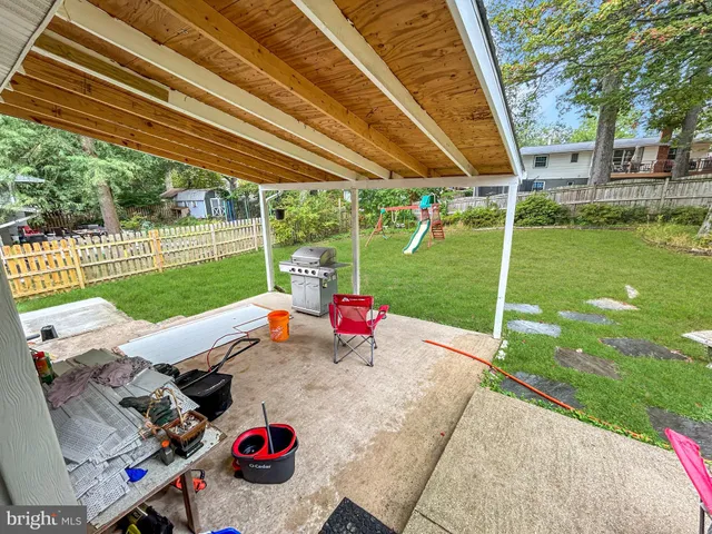 a view of a backyard with sitting area