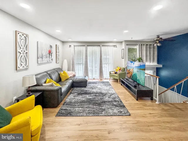 a living room with furniture and a rug
