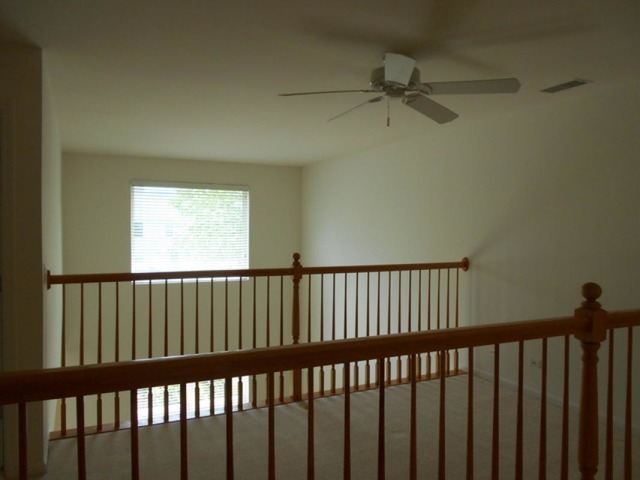 3040 Crystal Rock Road, Unit 3040 Naperville, IL 60564 - Photo 11 of 22 a view of a hallway with a window